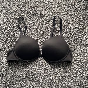 A black (pink) Victoria secret push up bra